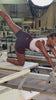 Reformer Pilates, kneeling leg lift in VYVRA