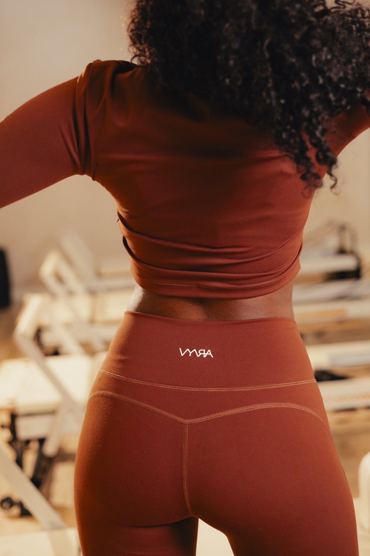 SoftHold fabric close-up, VYVRA Athletic Long Sleeve Top and Elevate V-Legging in Chocolate Brown